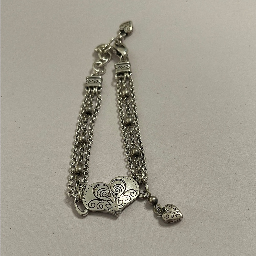 Brighton Reno Heart Bracelet featuring a scrolled heart pendant on triple chain